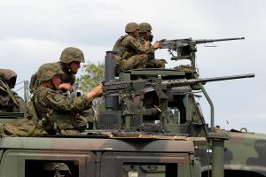 U.S. Marines fire pintle-mounted M-2 HB (heavy barrel) machine guns. 